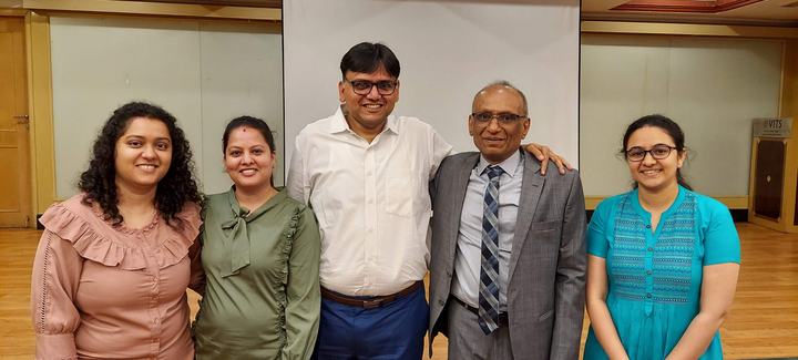 Five members of the GYR team stand together at the ARIA workshop.