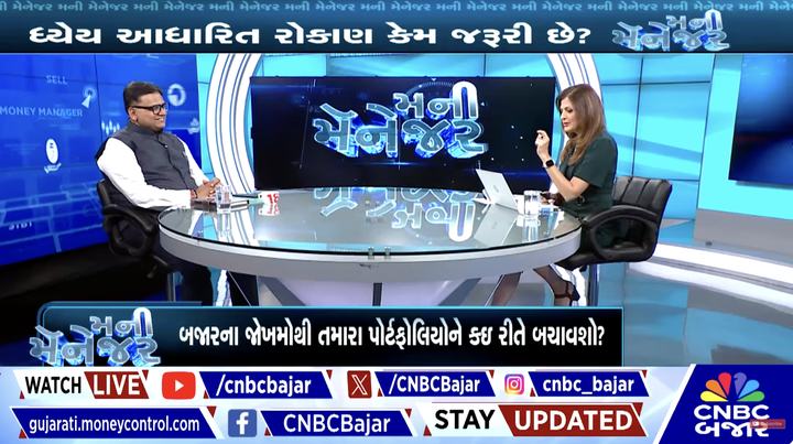 Rohit Shah on a CNBC Bajar studio panel, with Gujarati captions on screen.