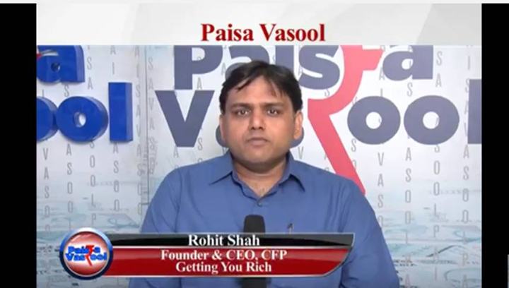 Rohit Shah in front of the Paisa Vasool backdrop.